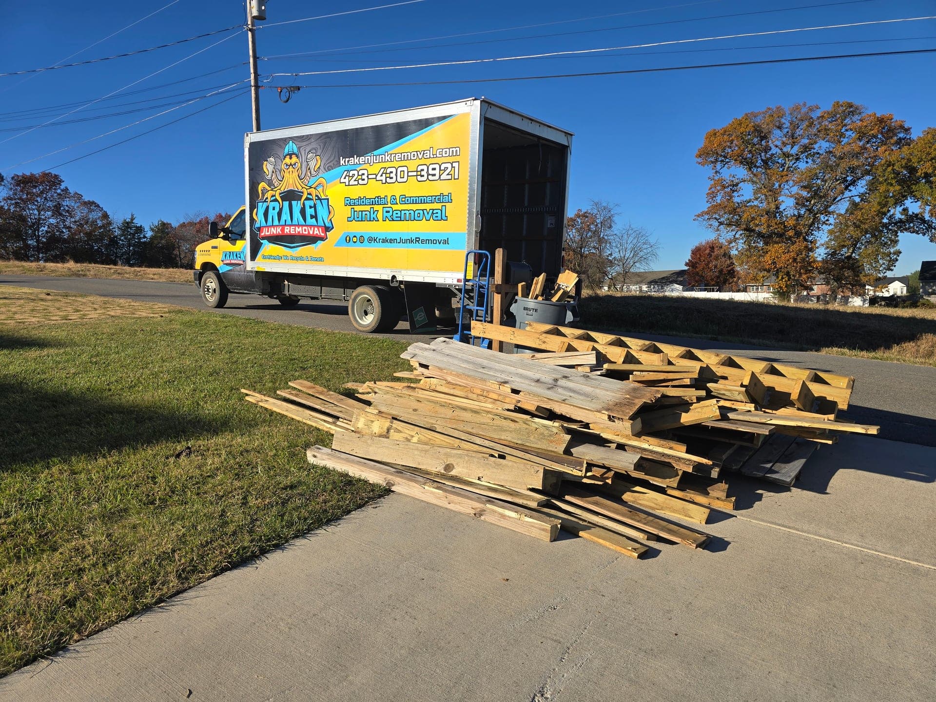 Kraken Junk Removal truck with construction debris ready for removal